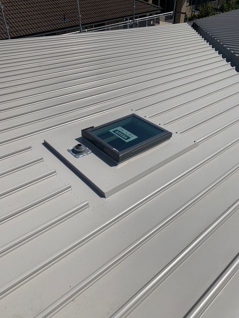 A white roof with a skylight on top of it. — R&M Sheetmetal Nowra Metal Roofing in Sussex, NSW