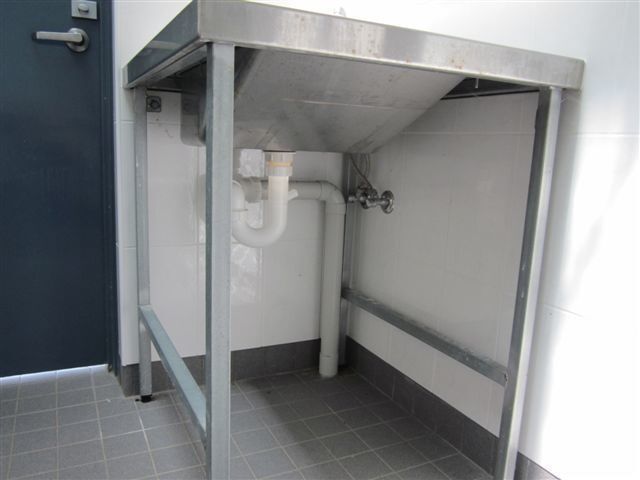 A Stainless Steel Table with A Pipe Underneath It — R&M Sheetmetal Nowra Metal Roofing in South Nowra, NSW