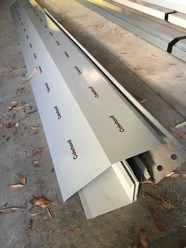 Long Pieces of Metal on The Floor — R&M Sheetmetal Nowra Metal Roofing in Berry, NSW