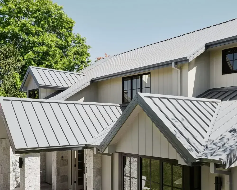 A white house with a metal roof and black windows. — R&M Sheetmetal Nowra Metal Roofing in South Nowra, NSW