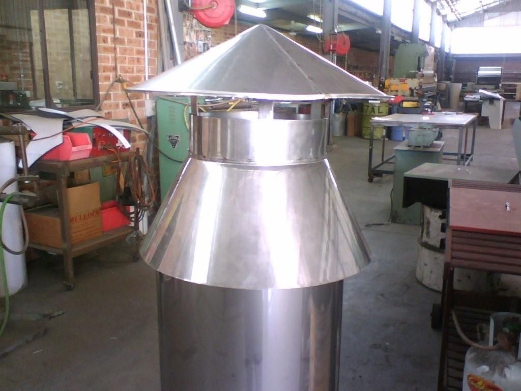 A stainless steel chimney with a cone shaped top — R&M Sheetmetal Nowra Metal Roofing in Culburra, NSW