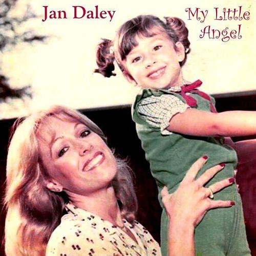 A woman is holding a little girl in her arms.