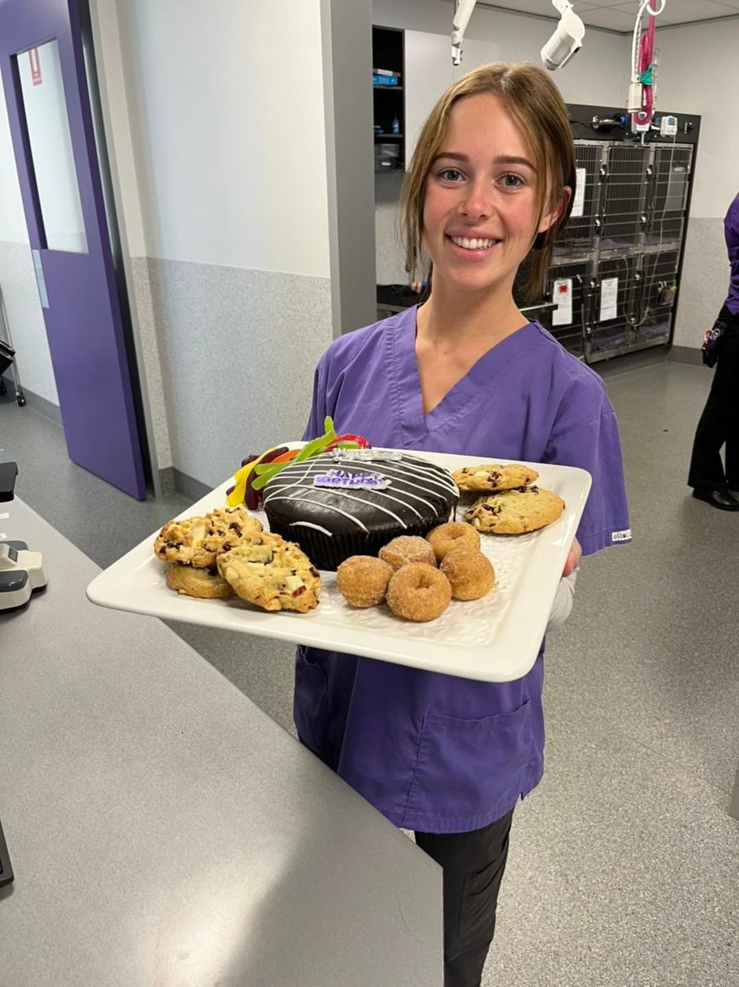 Nurse Vet Holding Cupcakes and Cookies — Albury, NSW — Petfocus Vetcare