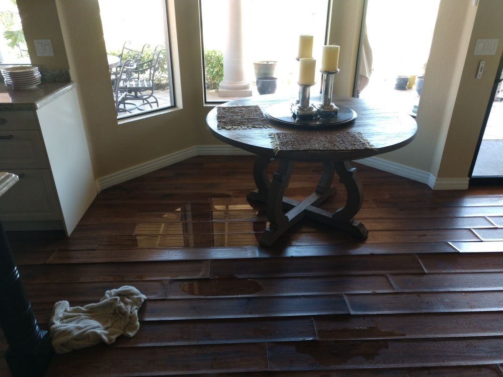 A wooden table with candles on it in a room