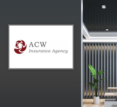 A picture of the acw insurance agency logo on a wall.