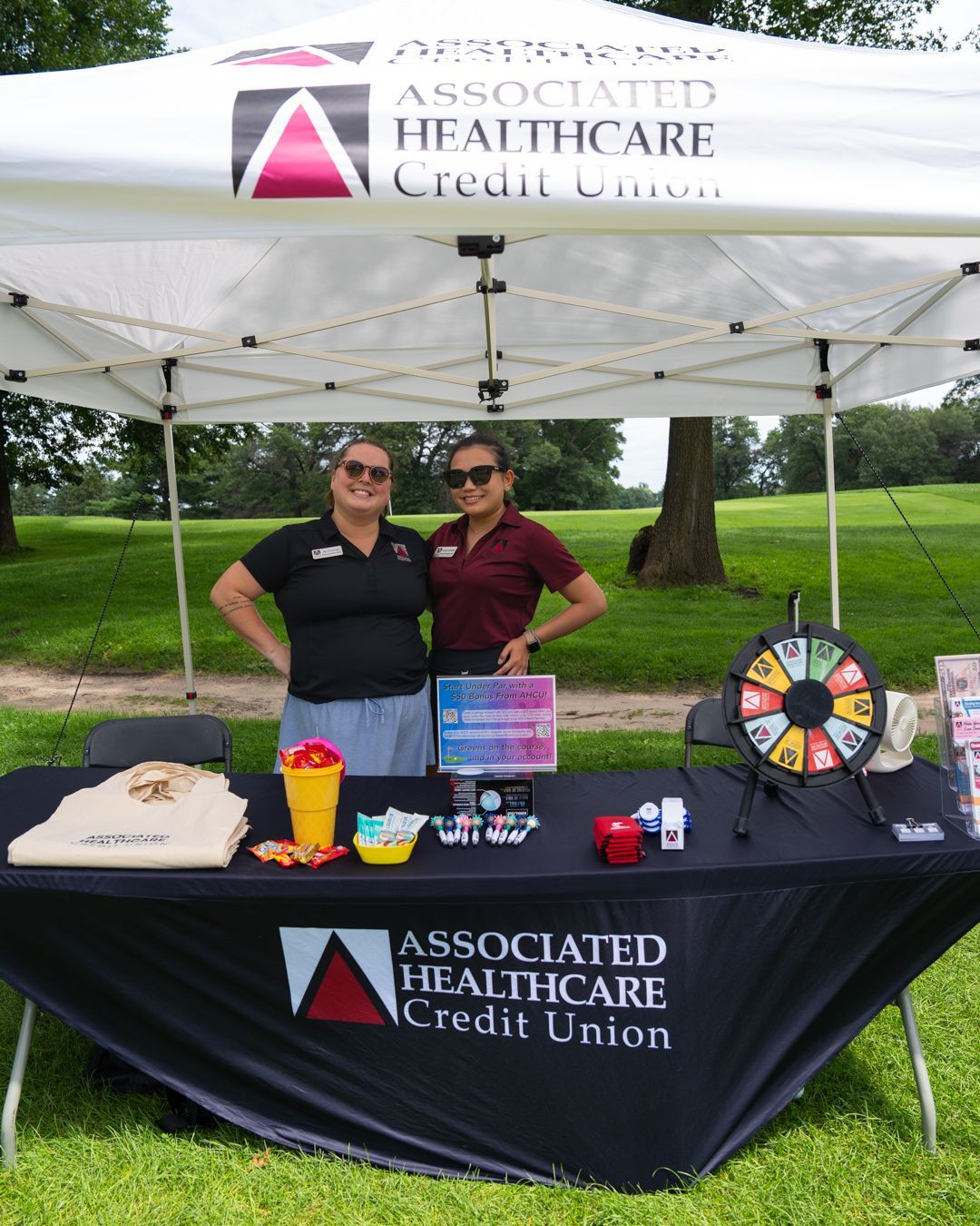 Associated Healthcare staff at their table at Chip In For Children