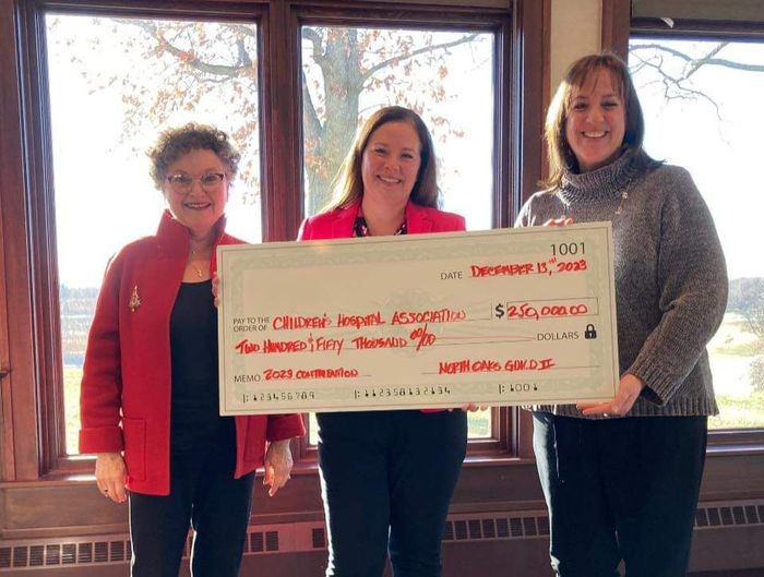 A $250,000 check is presented to CHA