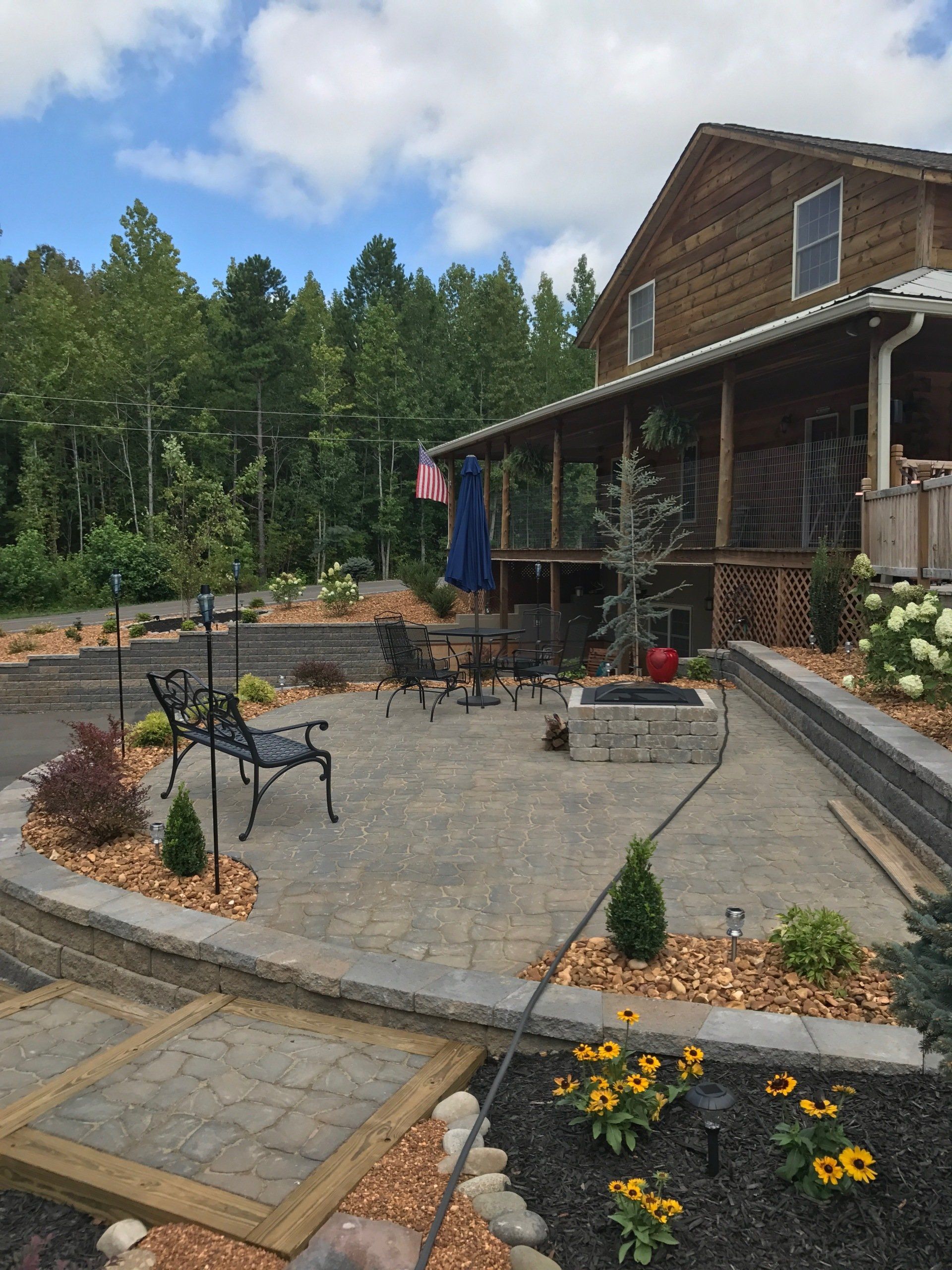concrete patio with four orange chairs