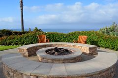 concrete fire pit overlooking lake