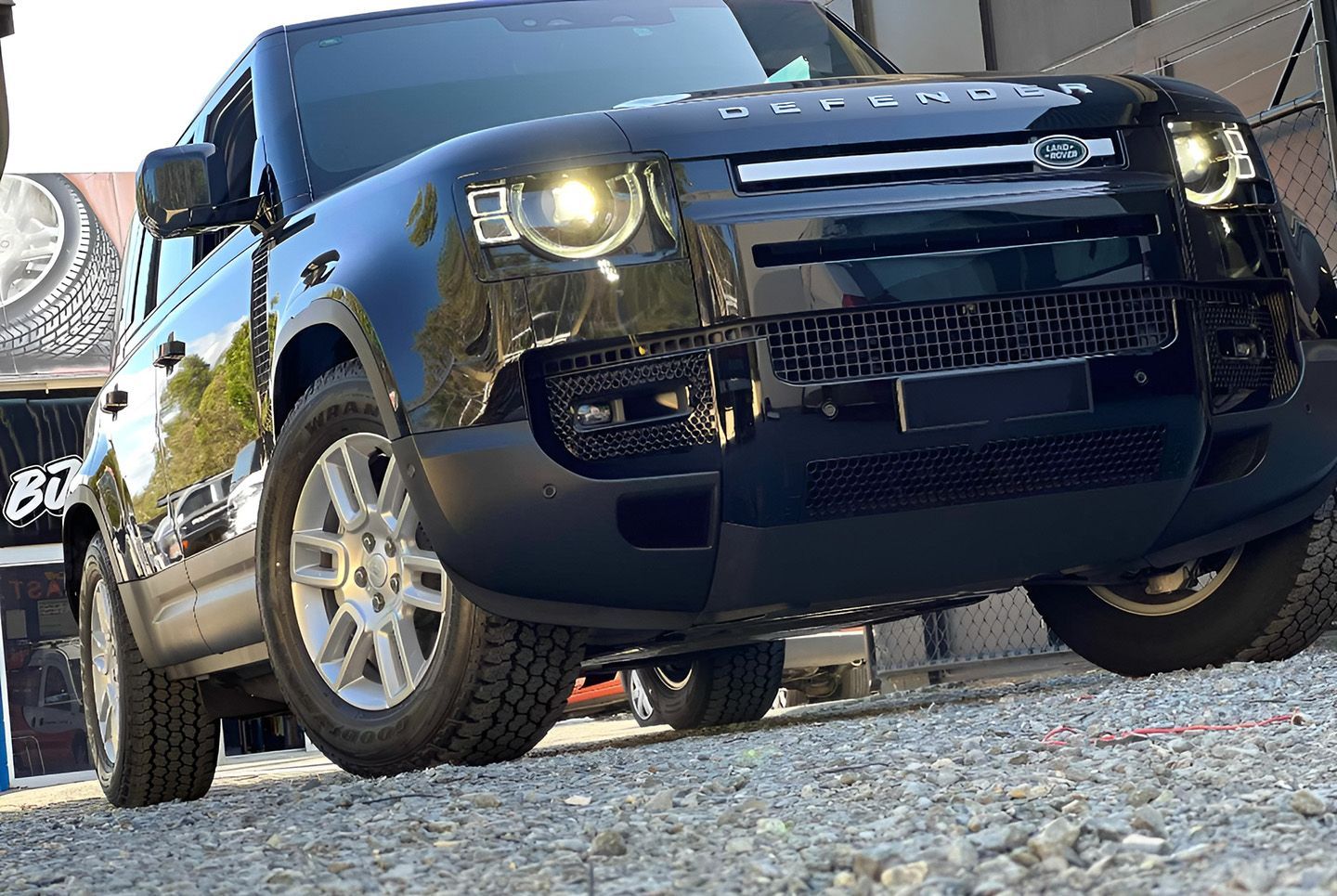 Land Rover Defender Front View On Gravel Surface