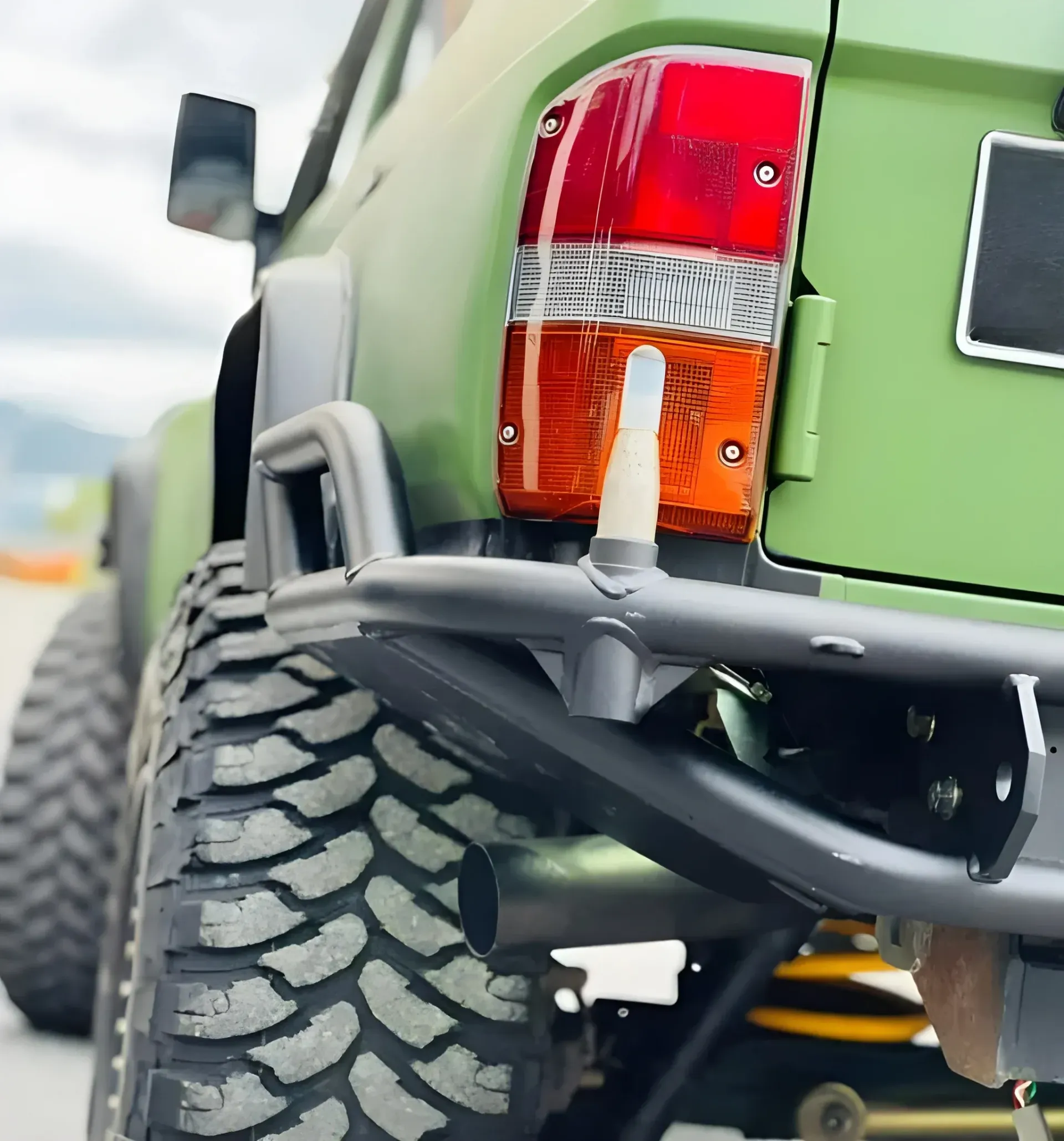 Green Off-road Vehicle Rear Corner — BJM Mechanical Mufflers & Tyres in Oxenford, QLD