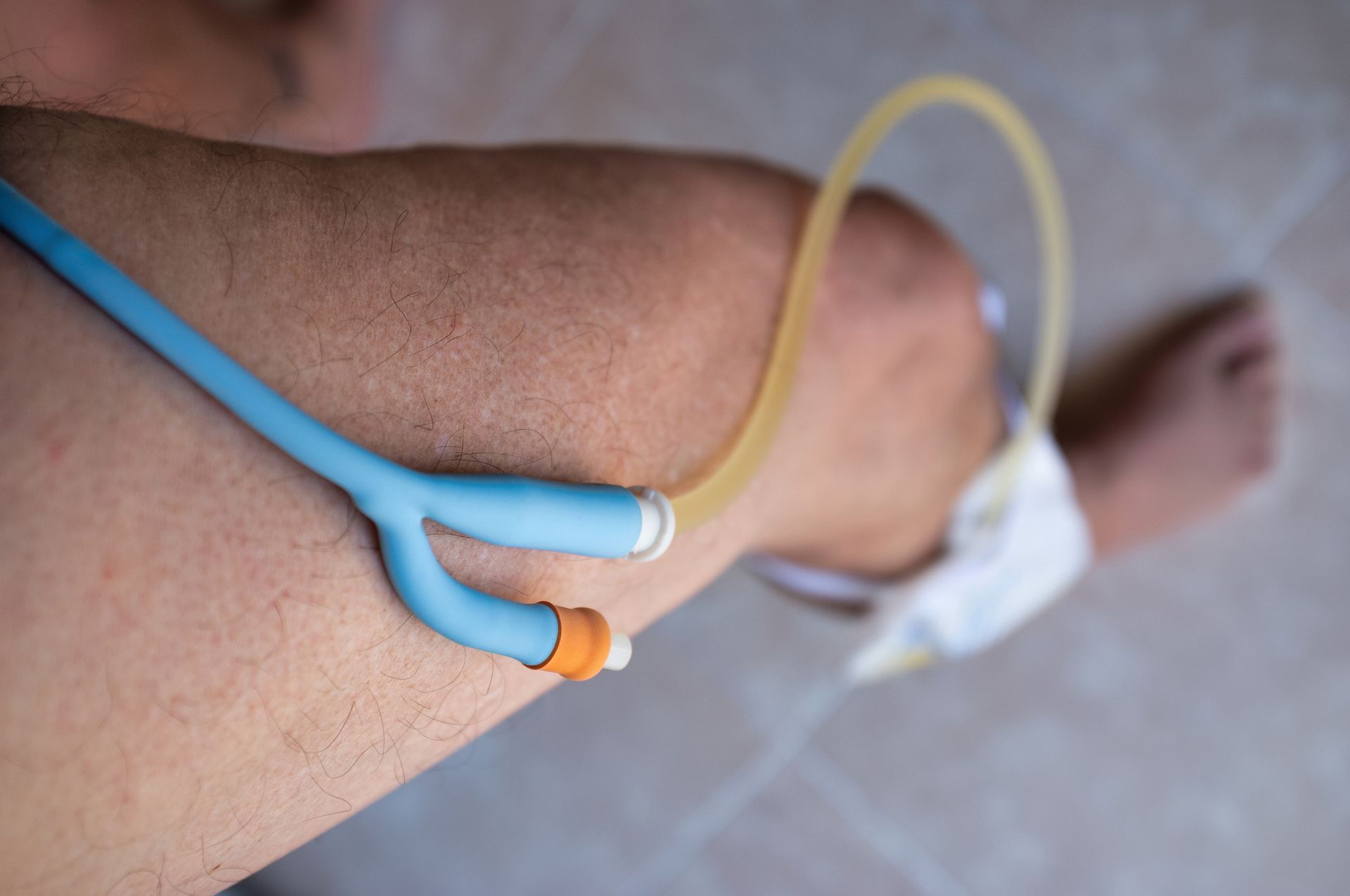 A close up of a person 's leg with a stethoscope attached to it.
