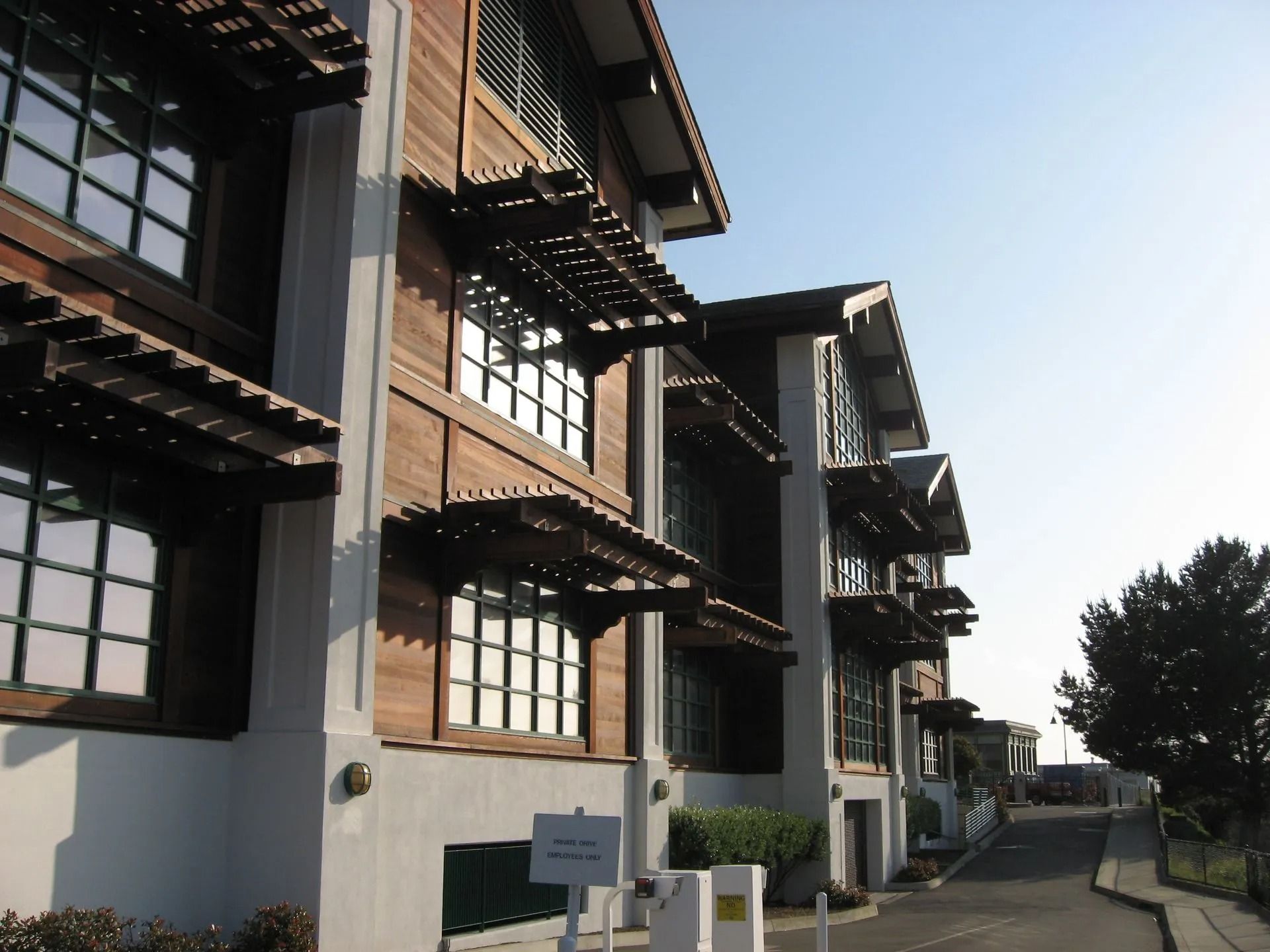 A row of apartment buildings with a sign that says 