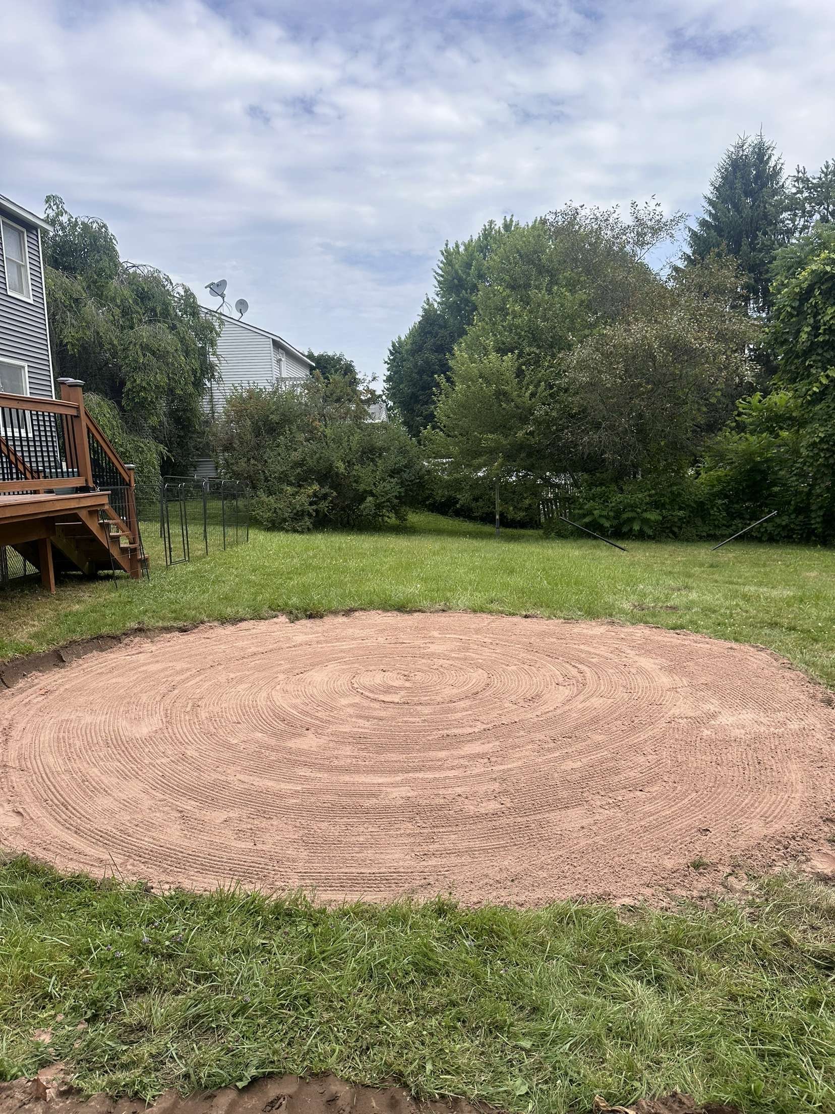 A white truck is parked in a parking lot next to a building.