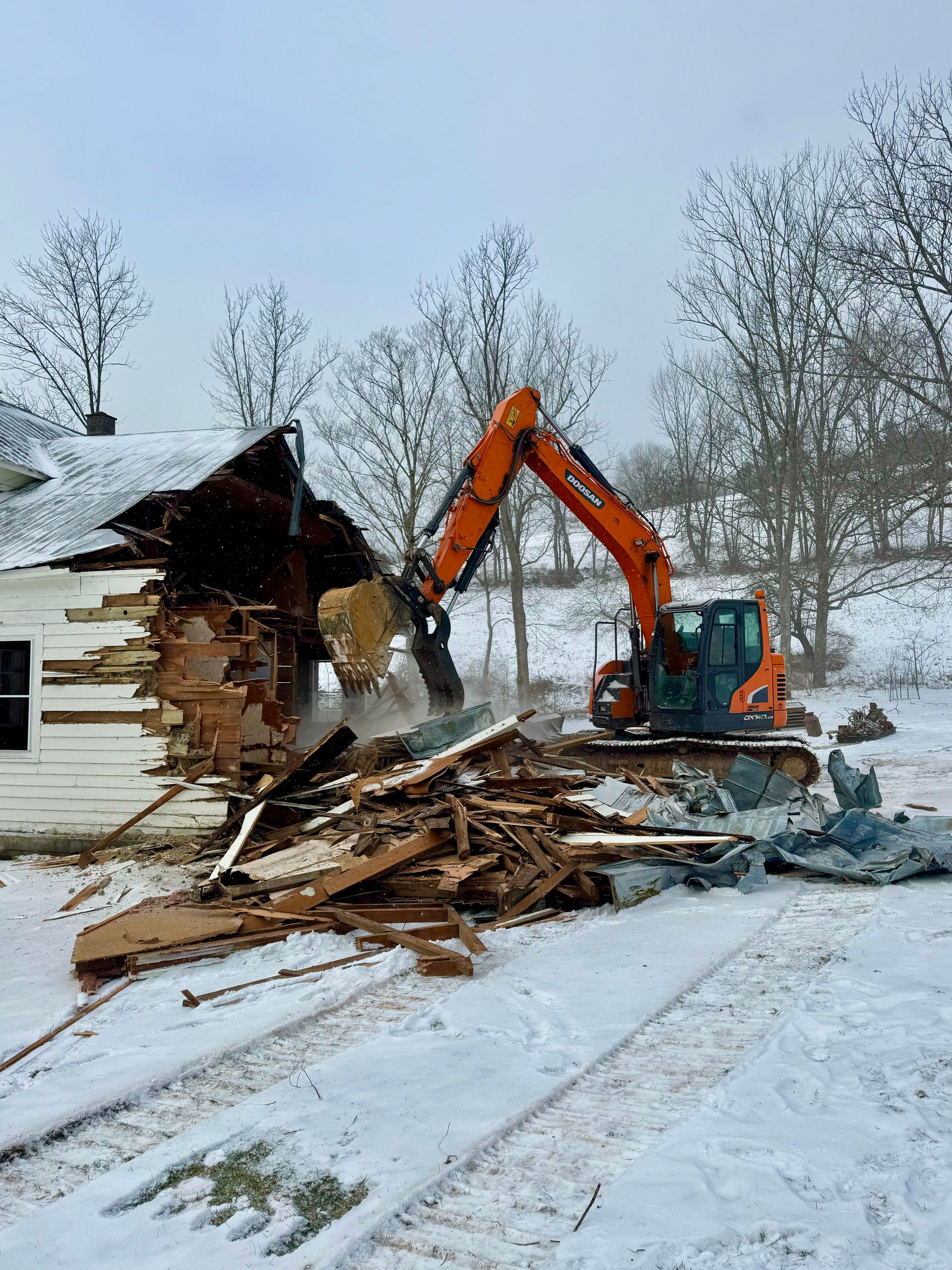 The inside of a moving truck filled with boxes and blankets.