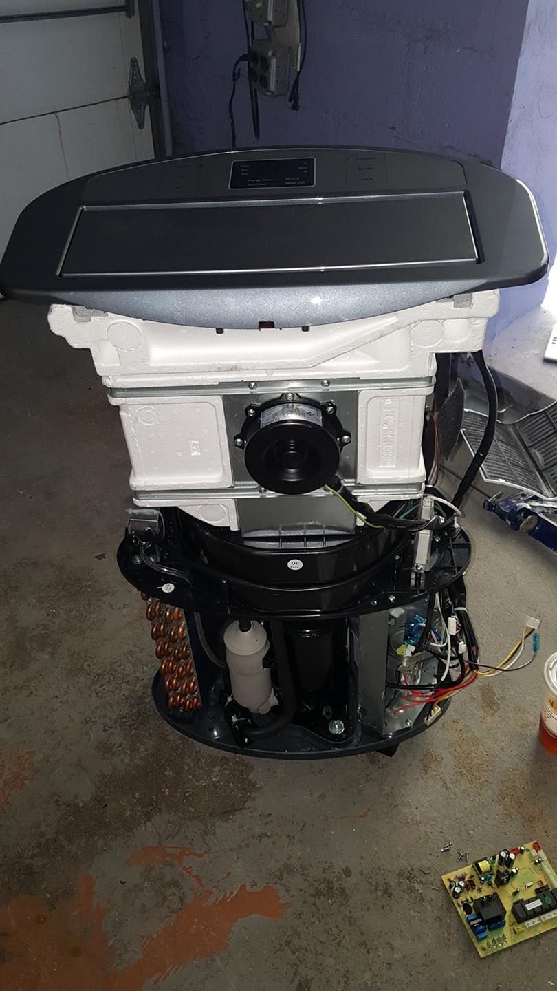 The inside of a refrigerator is being disassembled