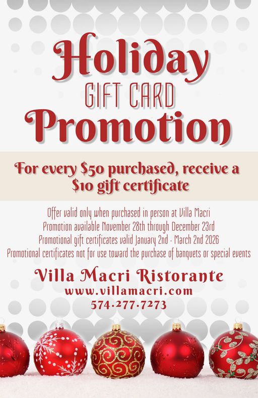 A woman is sitting in front of a fountain holding a guitar