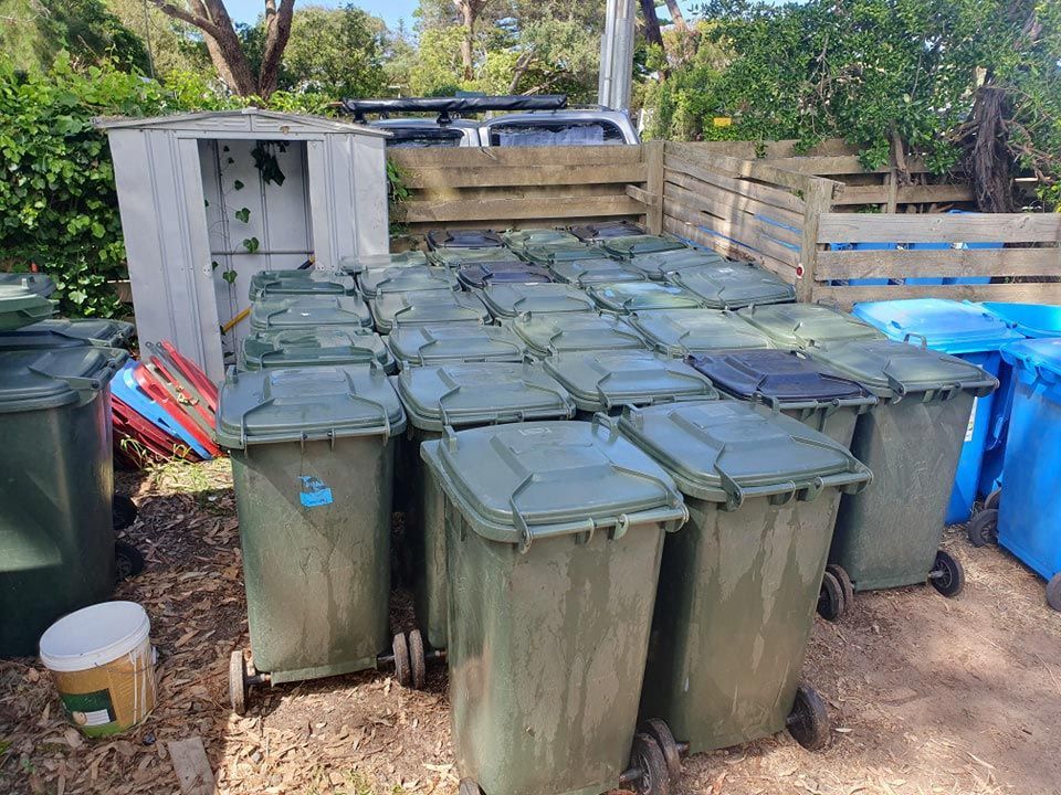 A Bunch Of Trash Cans Are Stacked On Top Of Each Other On The Ground — Bin in a Bath in Saint Albans Park, VIC