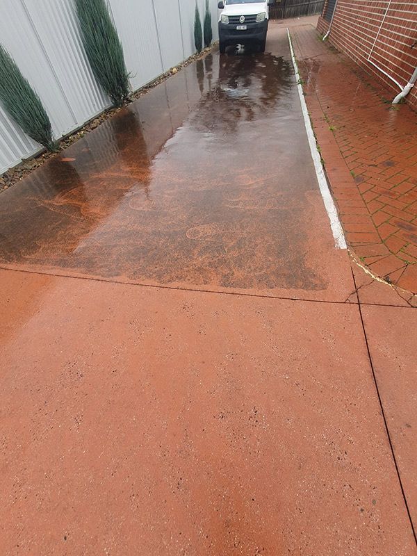 A Row Of Garbage Cans Are Lined Up On The Side Of The Road — Bin in a Bath in Saint Albans Park, VIC