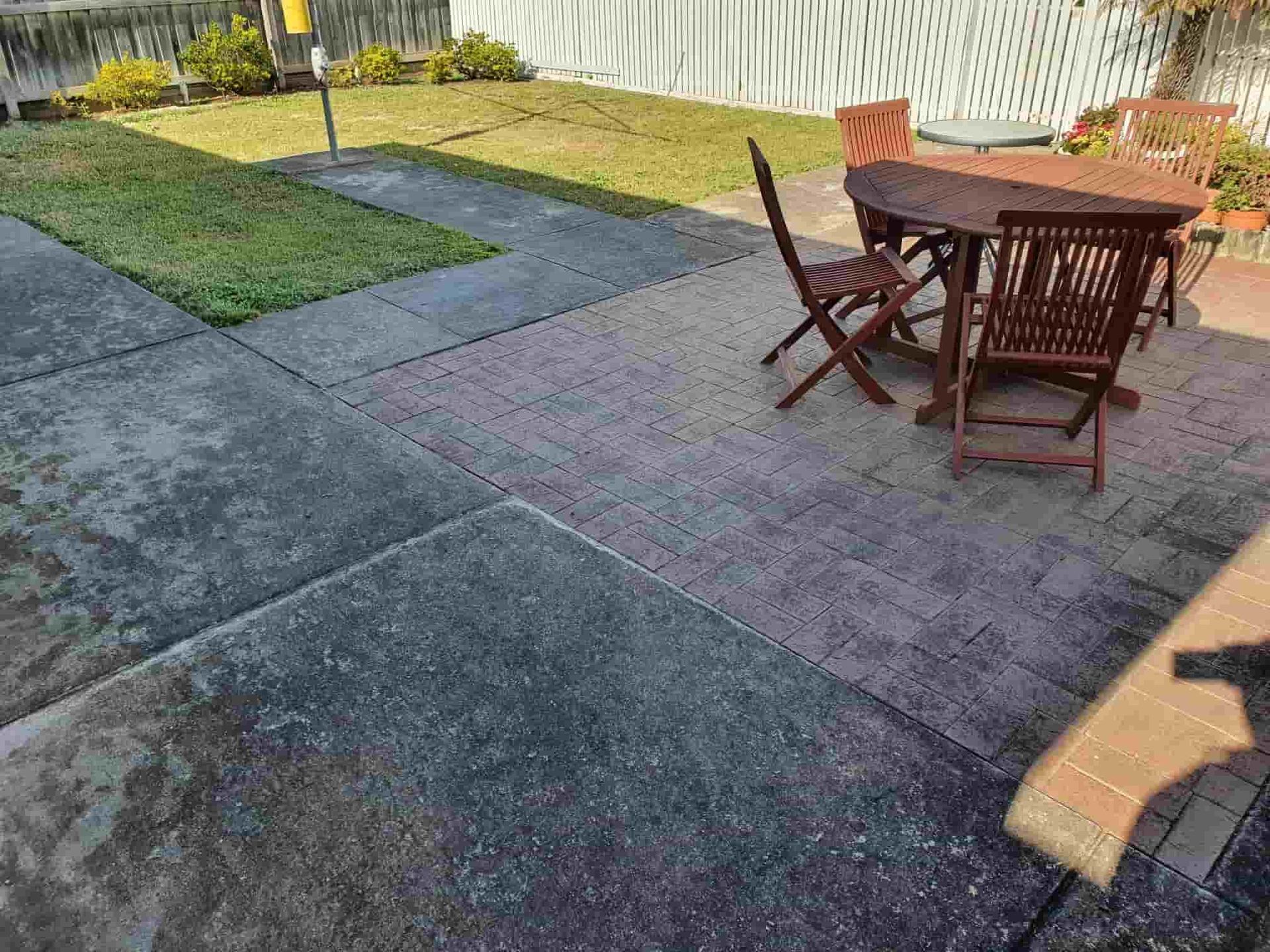 A Patio With a Table and Chairs in a Backyard — Bin in a Bath in Melbourne, VIC