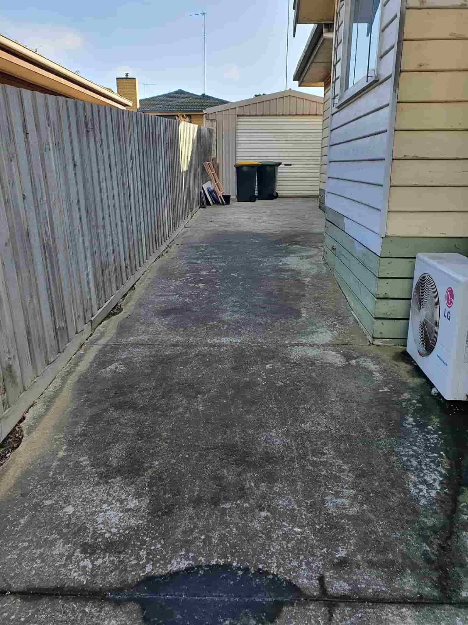 A Concrete Walkway Leading to a House With a Wooden Fence — Bin in a Bath in Melbourne, VIC