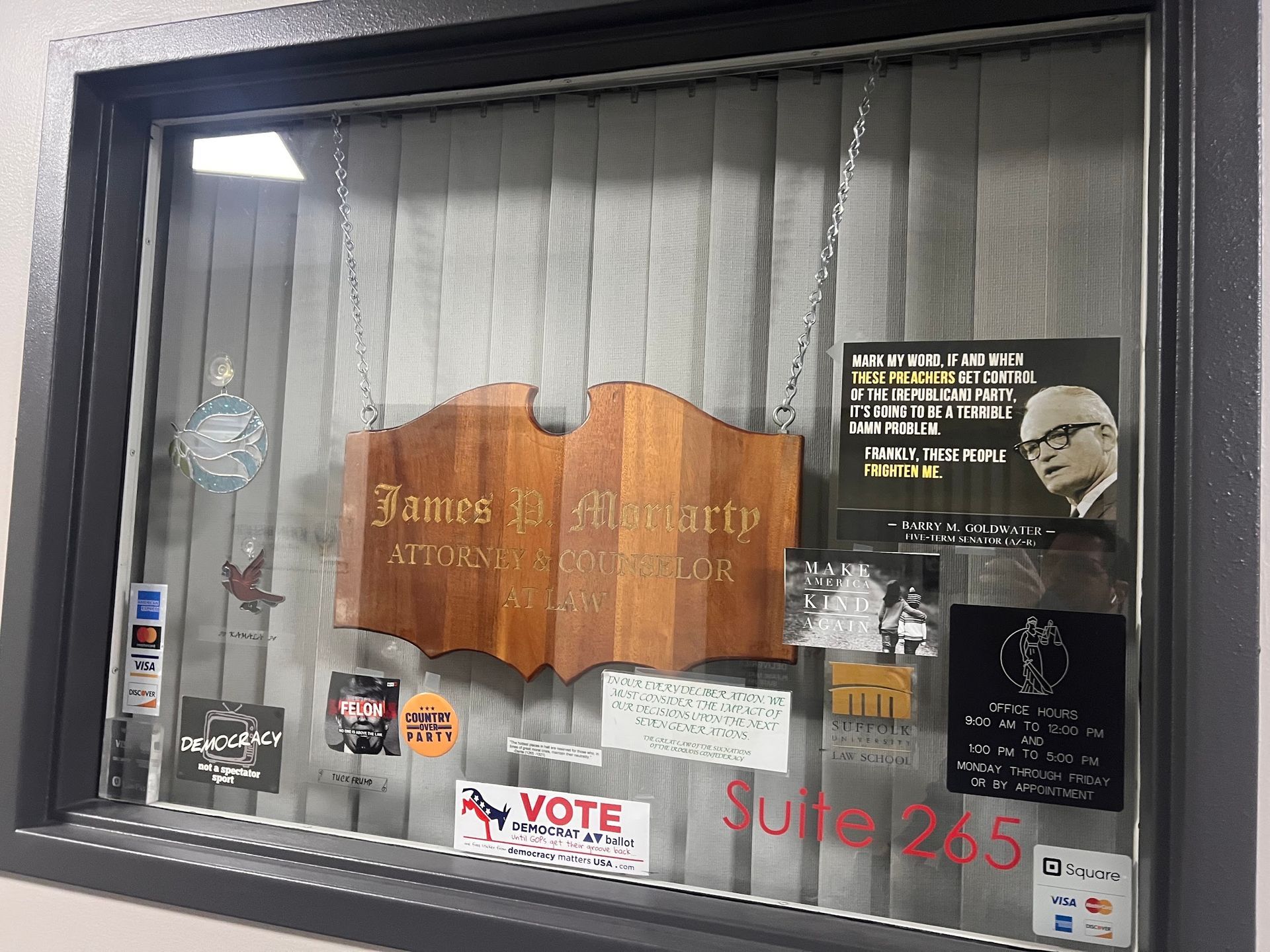 A window with a sign that says vote on it