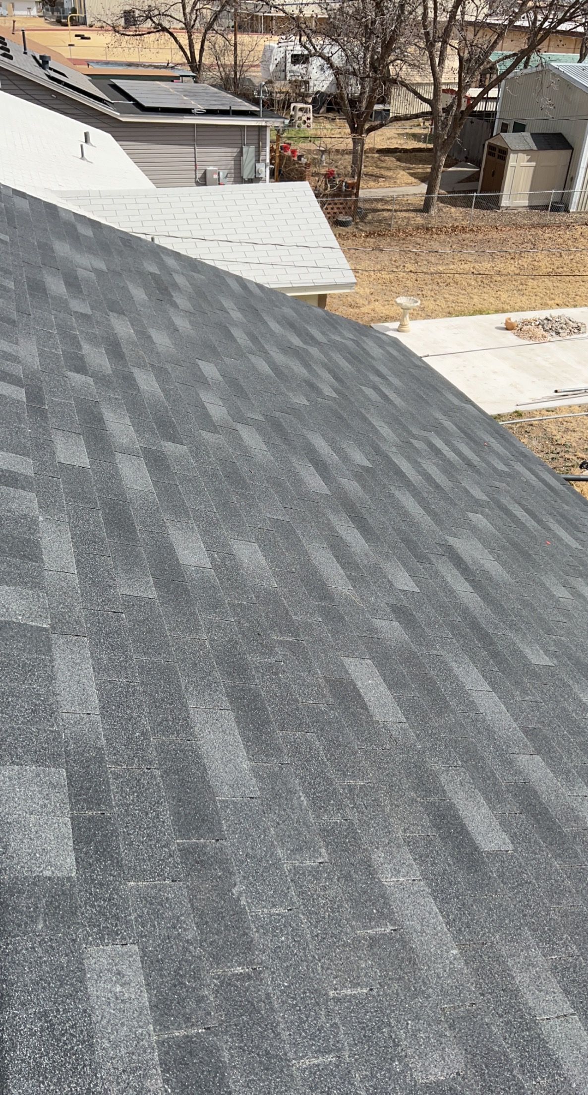 A close up of a roof with a lot of shingles on it.