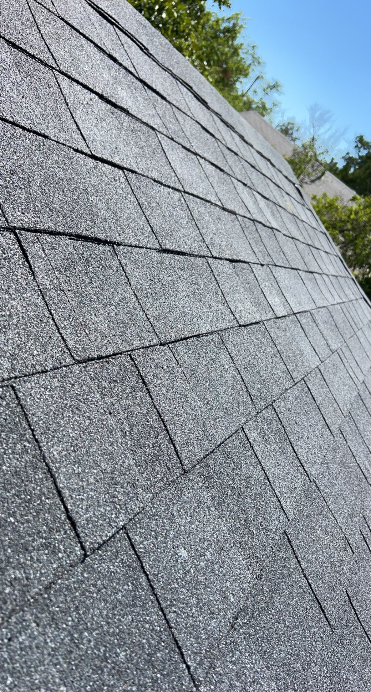 A close up of a roof with shingles on it.
