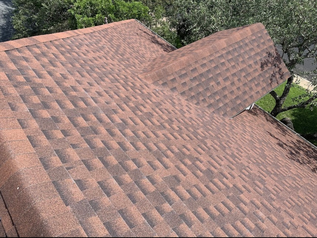 A close up of a roof with a lot of shingles on it.
