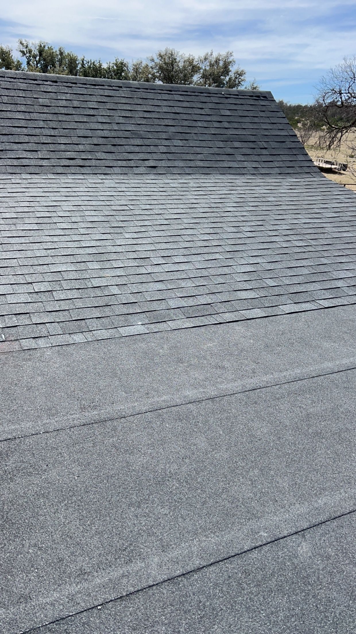 A close up of a roof with a lot of shingles on it.