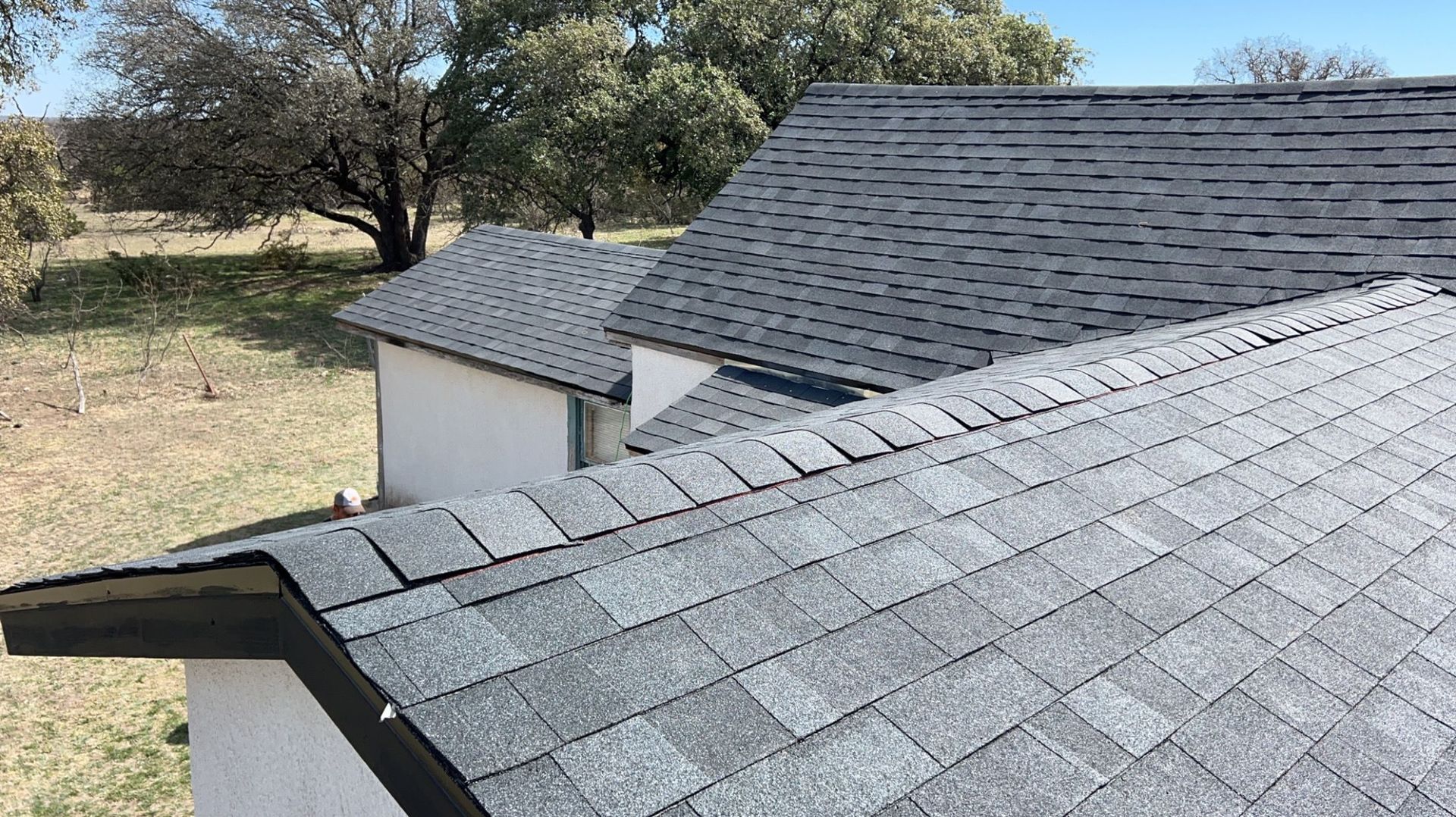 A close up of a roof of a house with a lot of shingles on it.