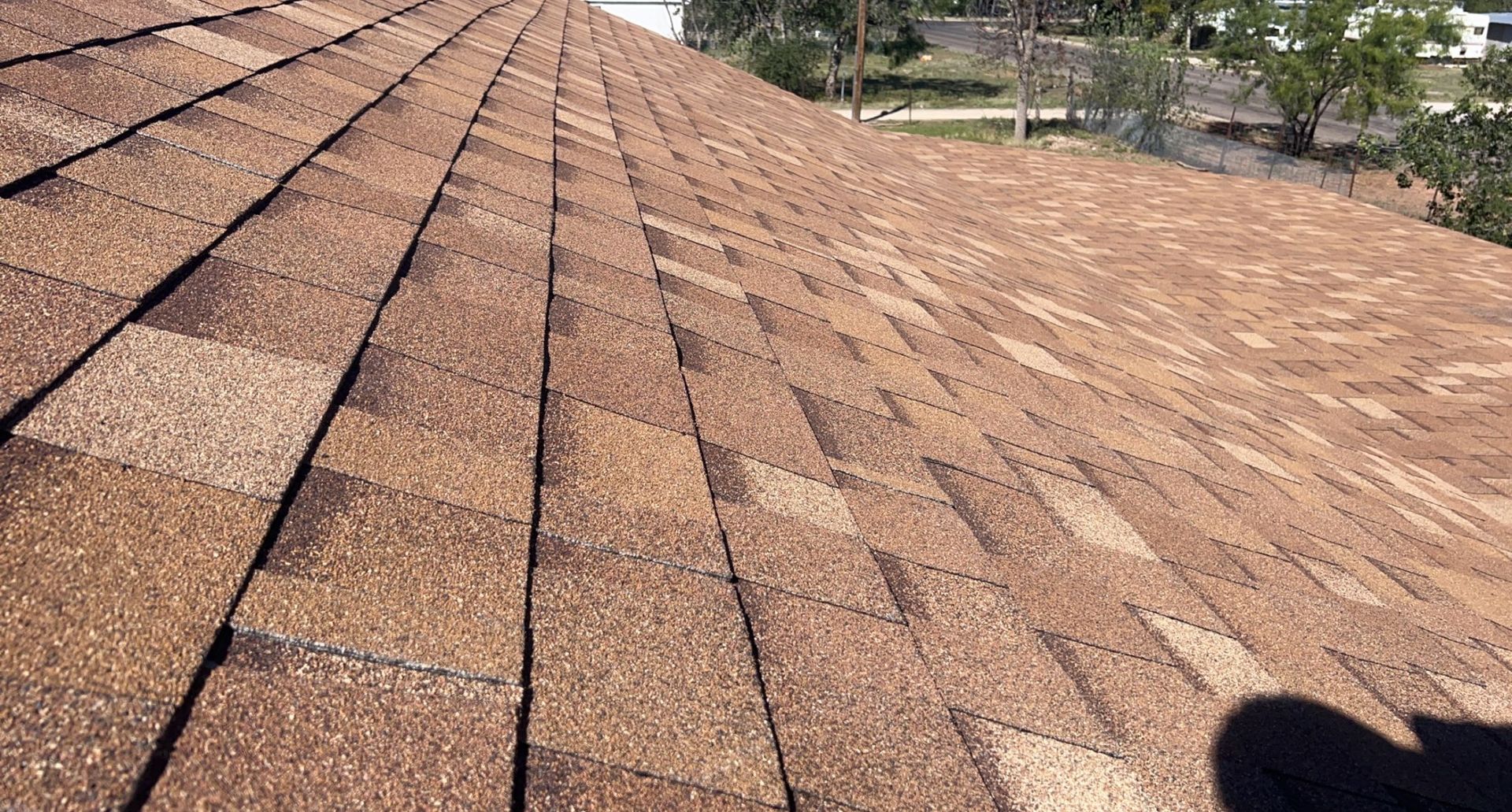 A close up of a roof with a lot of shingles on it.