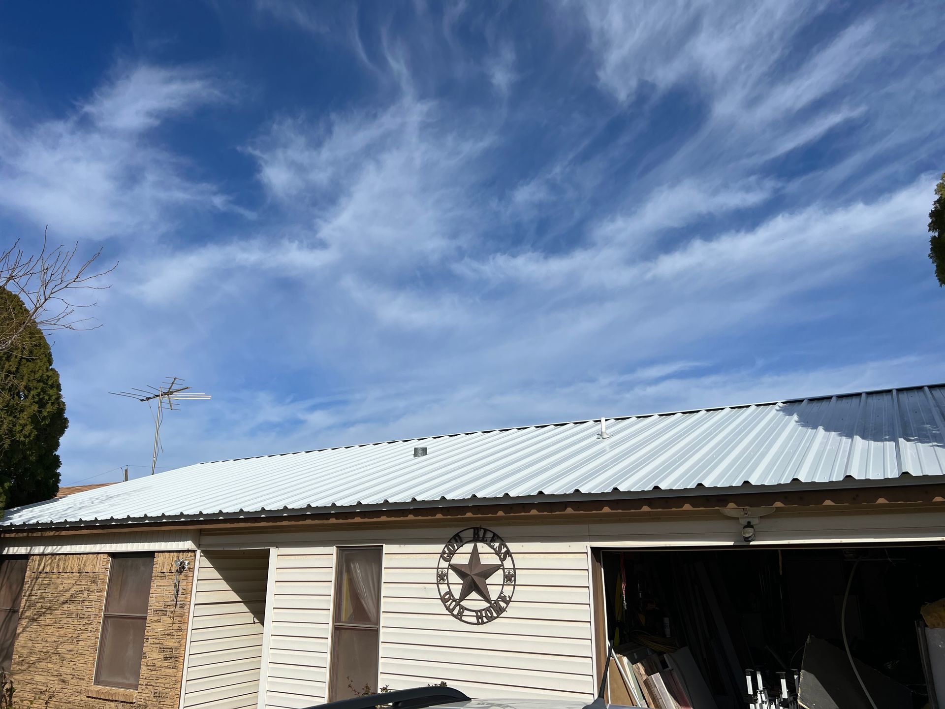 A house with a white roof and a star on it