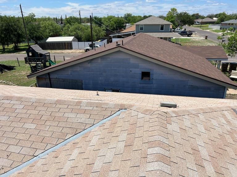 A rooftop view of a house in a residential area