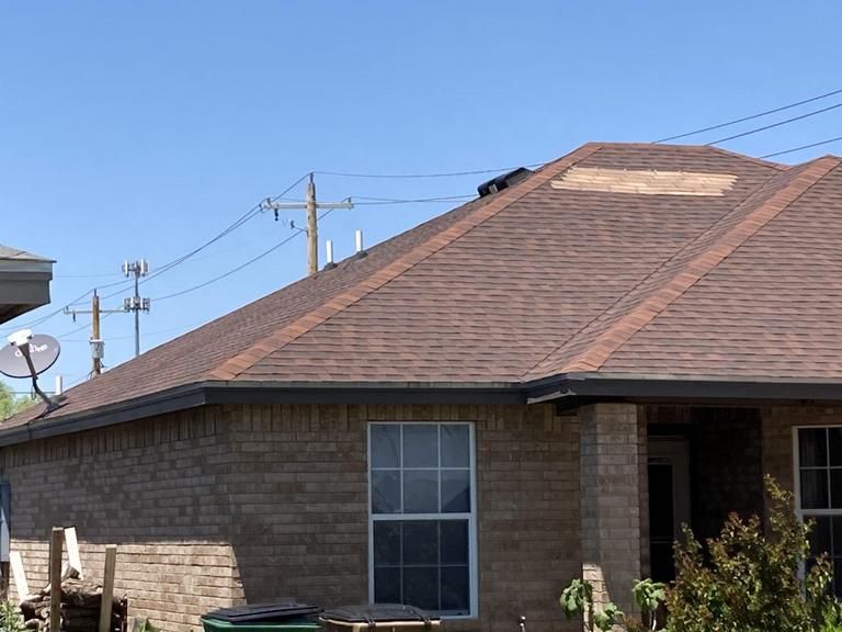 A house with a satellite dish on the roof