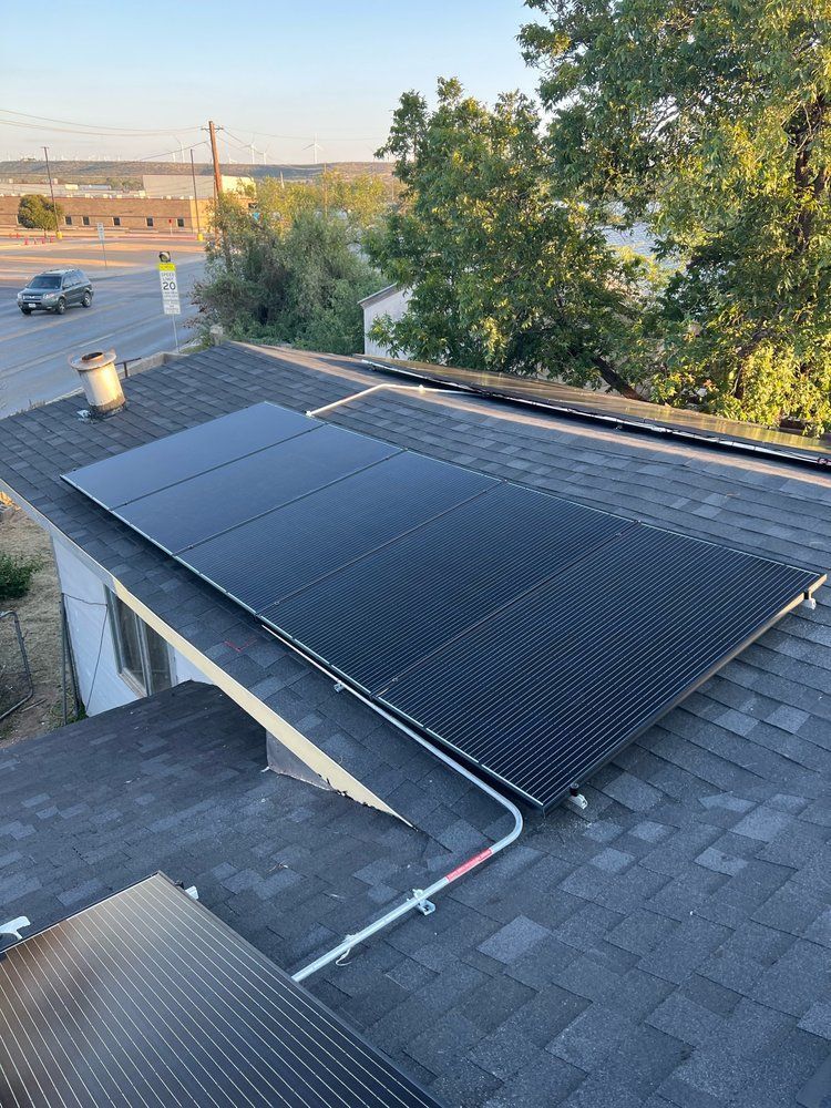 A roof with a lot of solar panels on it