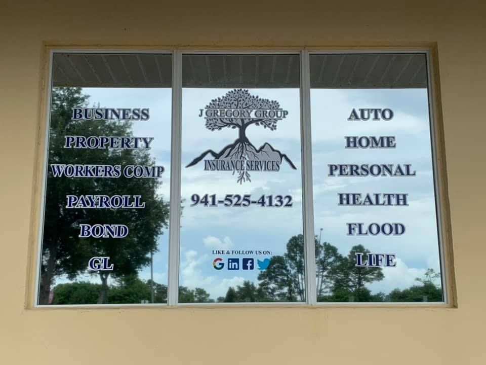 Window with insurance services listed: Business, Auto, Home, etc., and a logo with phone number.