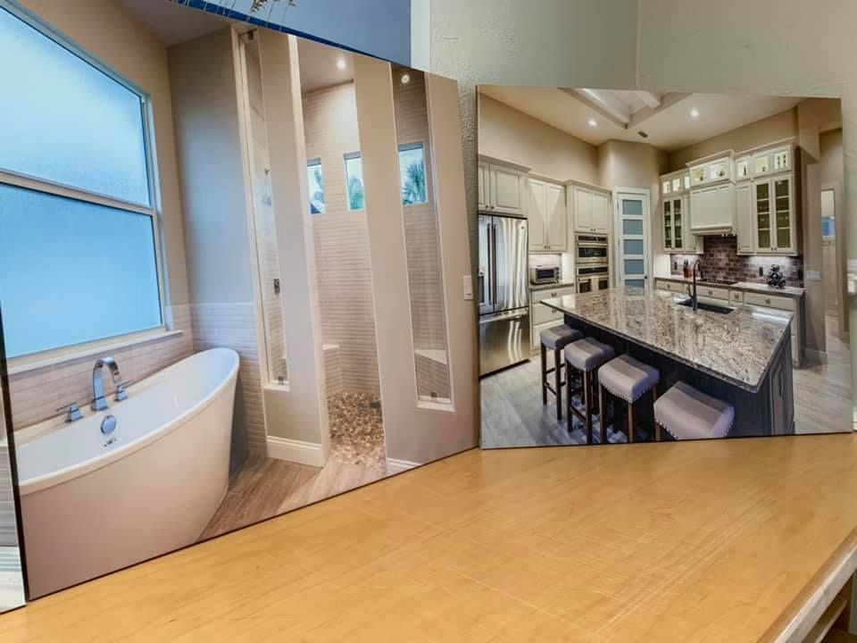 Bathroom with bathtub, shower, and kitchen with island and stools.