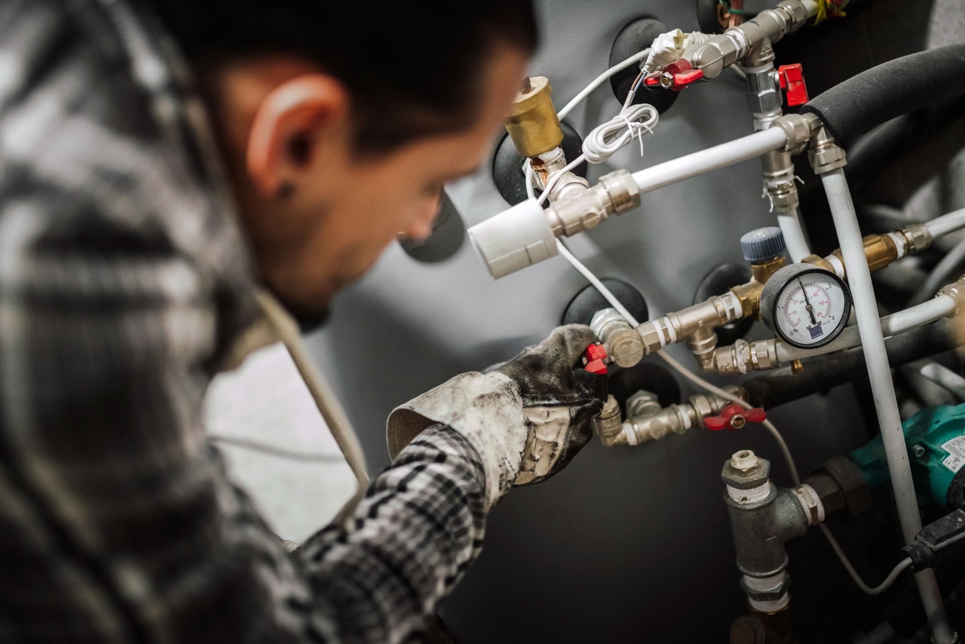 Heating engineer fixing modern heating system Heating engineer fixing modern heating system