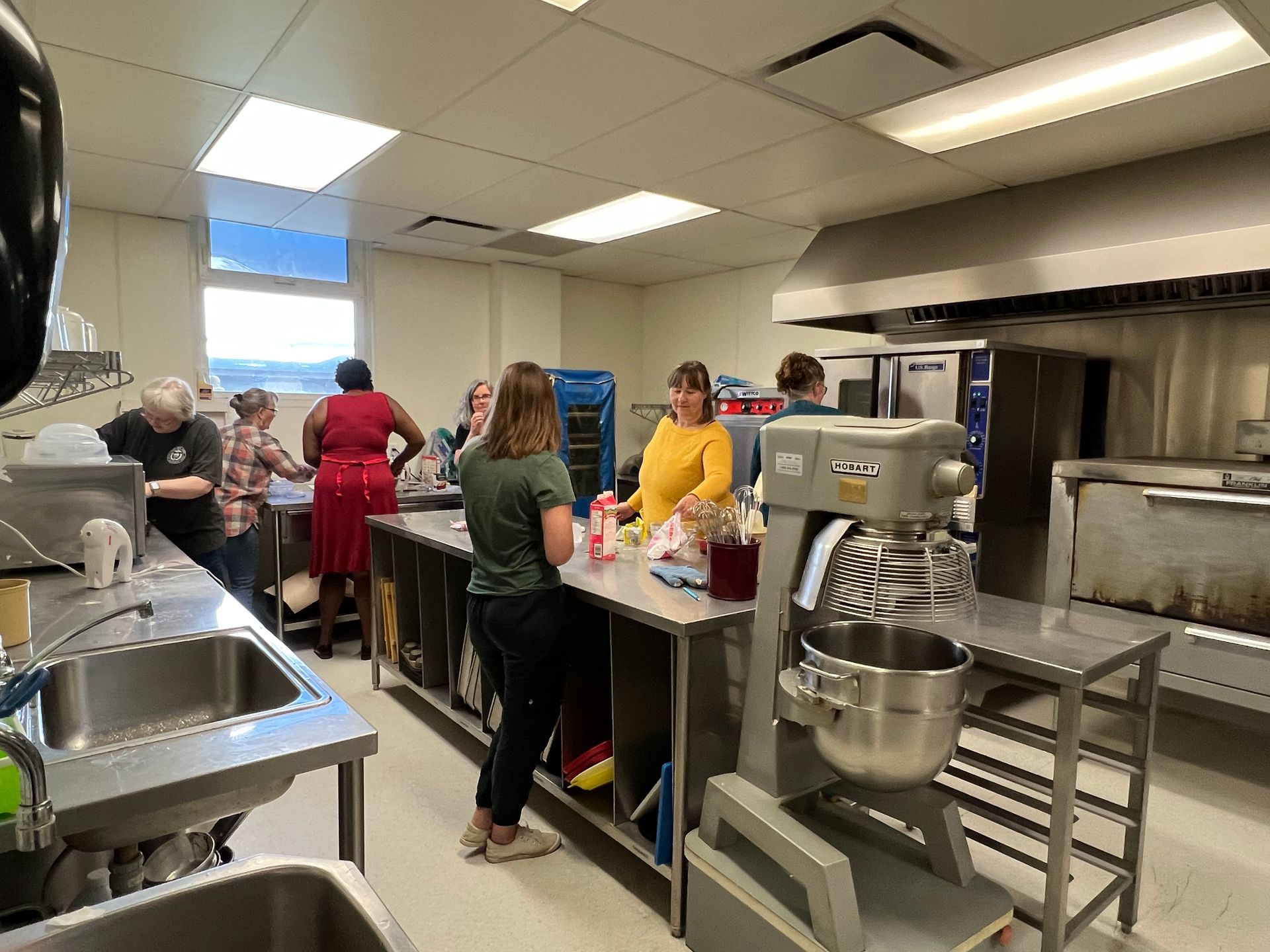 Heritage Common commercial kitchen people cooking