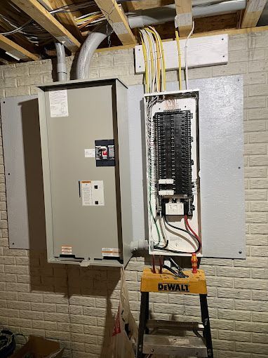 A ladder is sitting next to a electrical box in a basement.