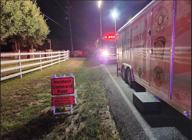 A sign on the side of the road says resident command post