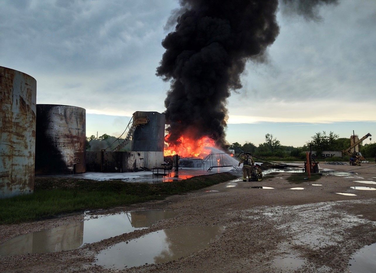 A large amount of smoke is coming out of a building.