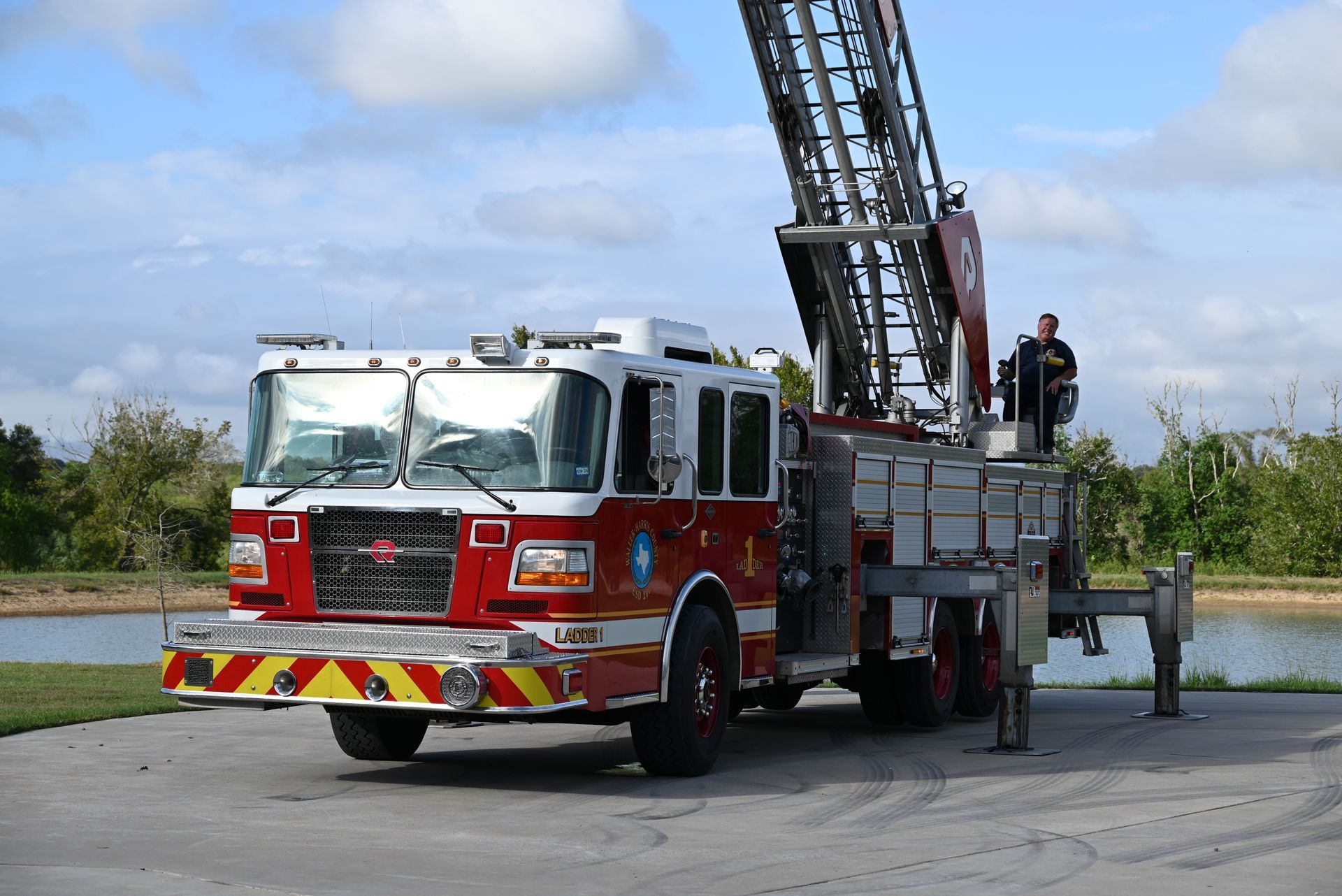 A Waller-Harris County ESD 200 aerial truck with it's aerial ladder extended upwards.