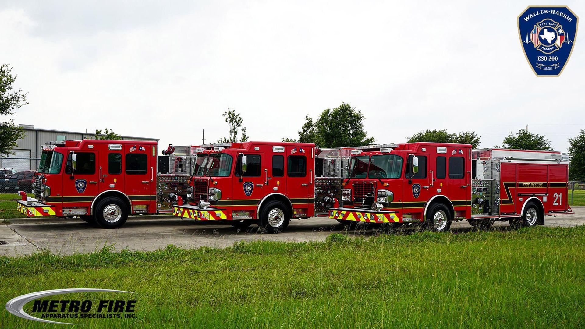 A row of red fire trucks parked next to each other