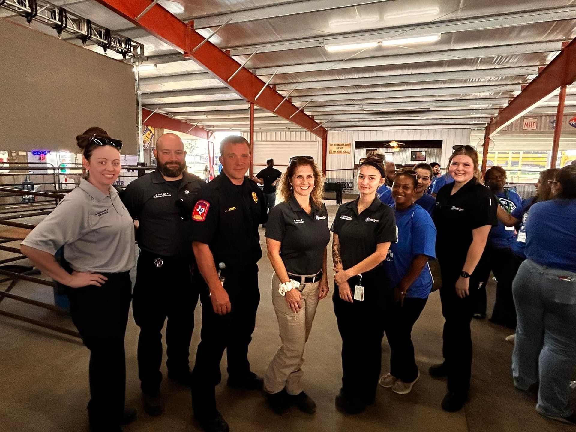 A group of people are posing for a picture in a room.