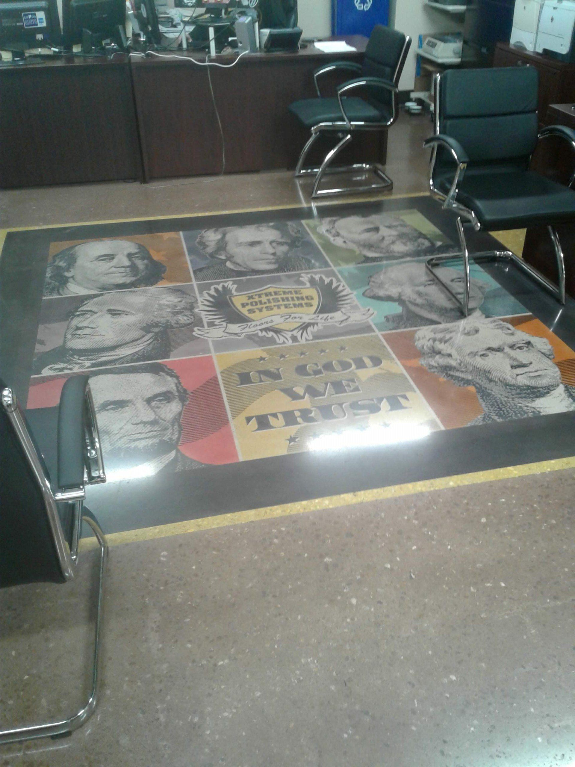 A poster on the floor says in god we trust