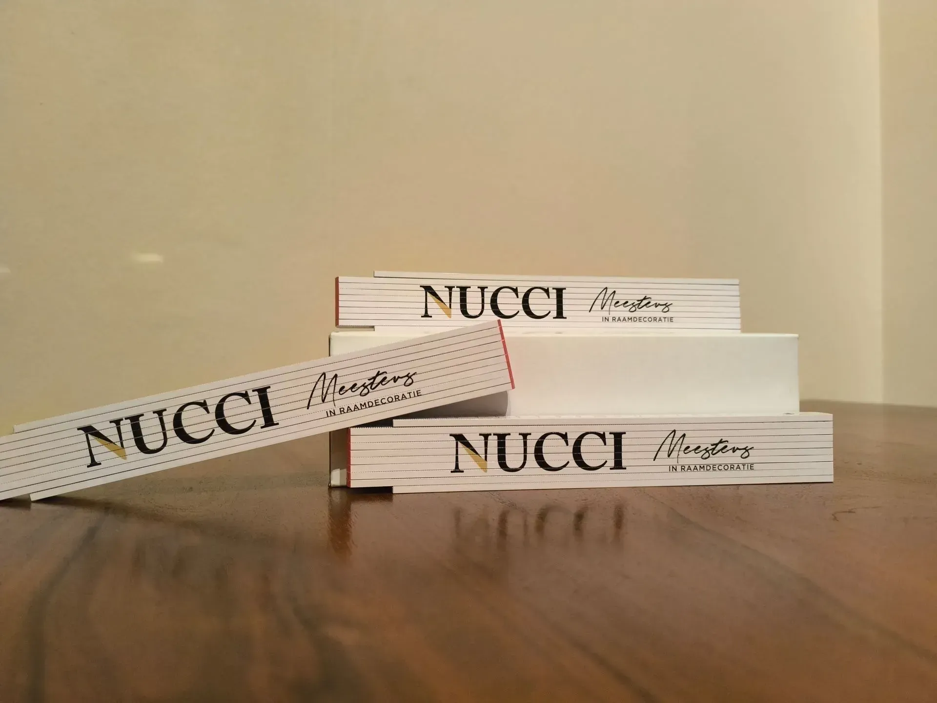 vouwmeters met logo nucci erop