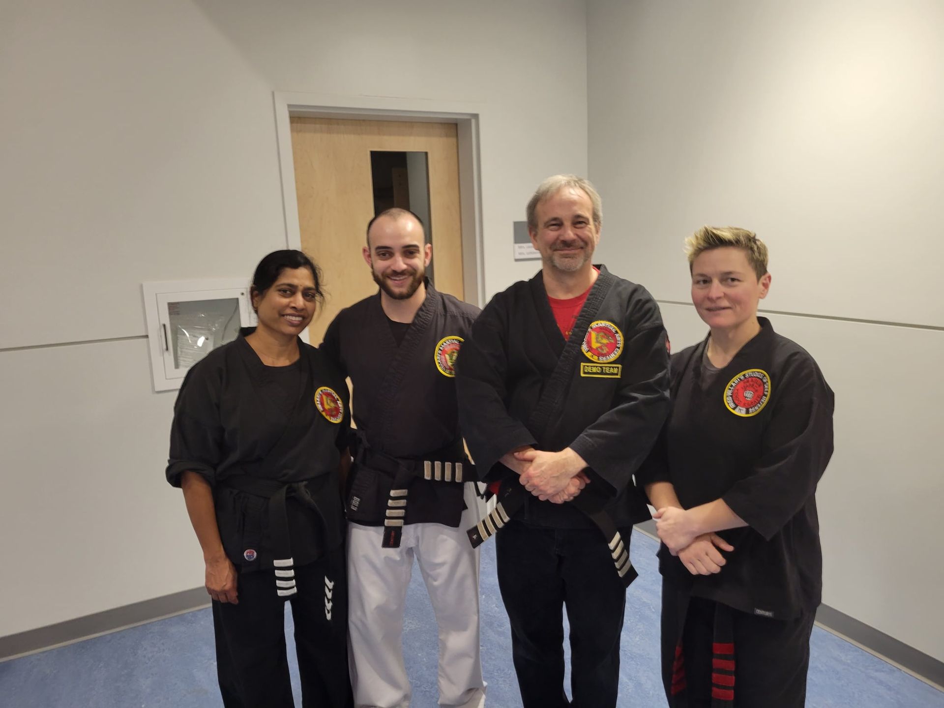 a group of men pose in front of a banner that says villari 's