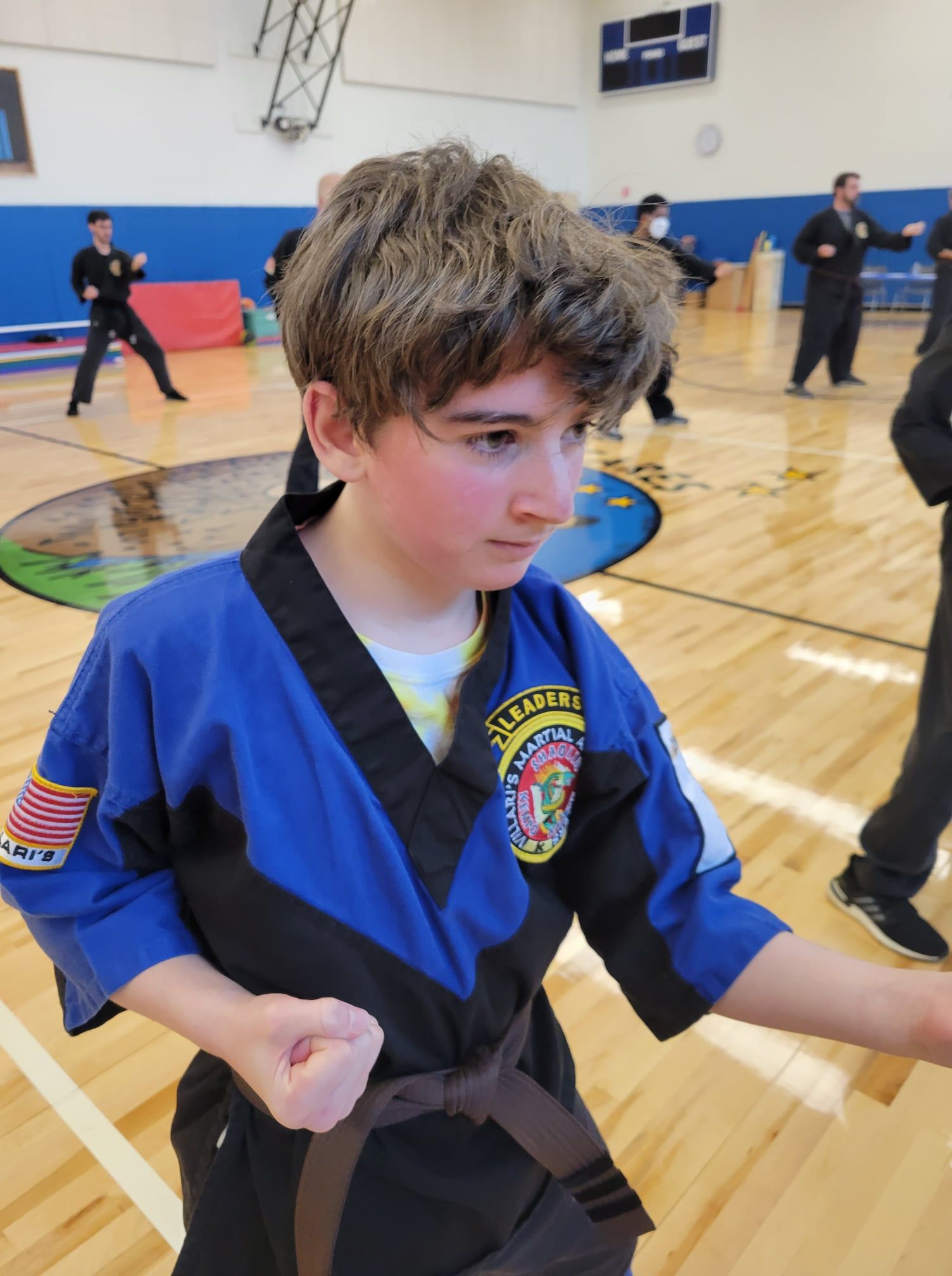 a table filled with gold medals and red ribbons .